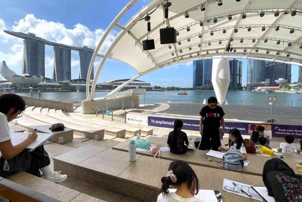 Children sketching Marina Bay Sands at DBS Foundation Outdoor Theatre
